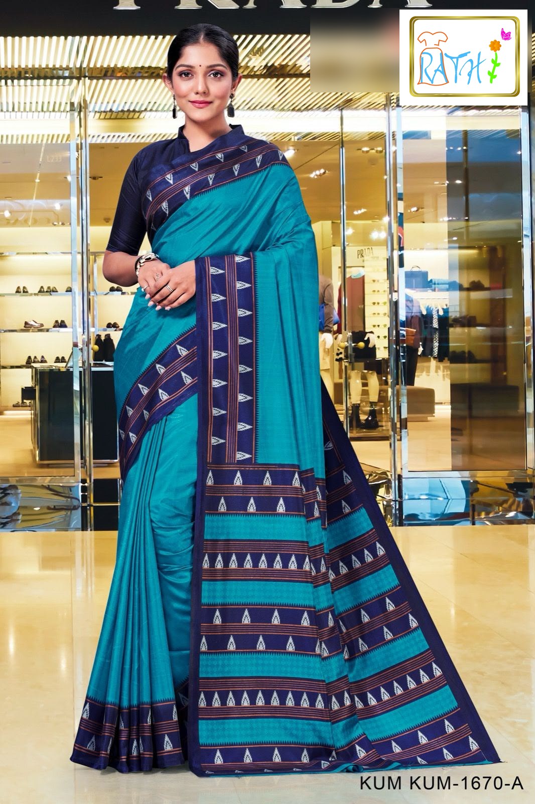 Eshanya — turquoise uniform saree with navy temple border, Rathi Silks