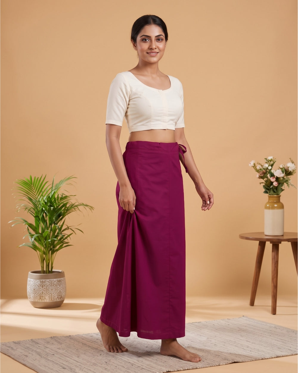Dark Pink cotton saree petticoat, model with background #colour_dark-pink
