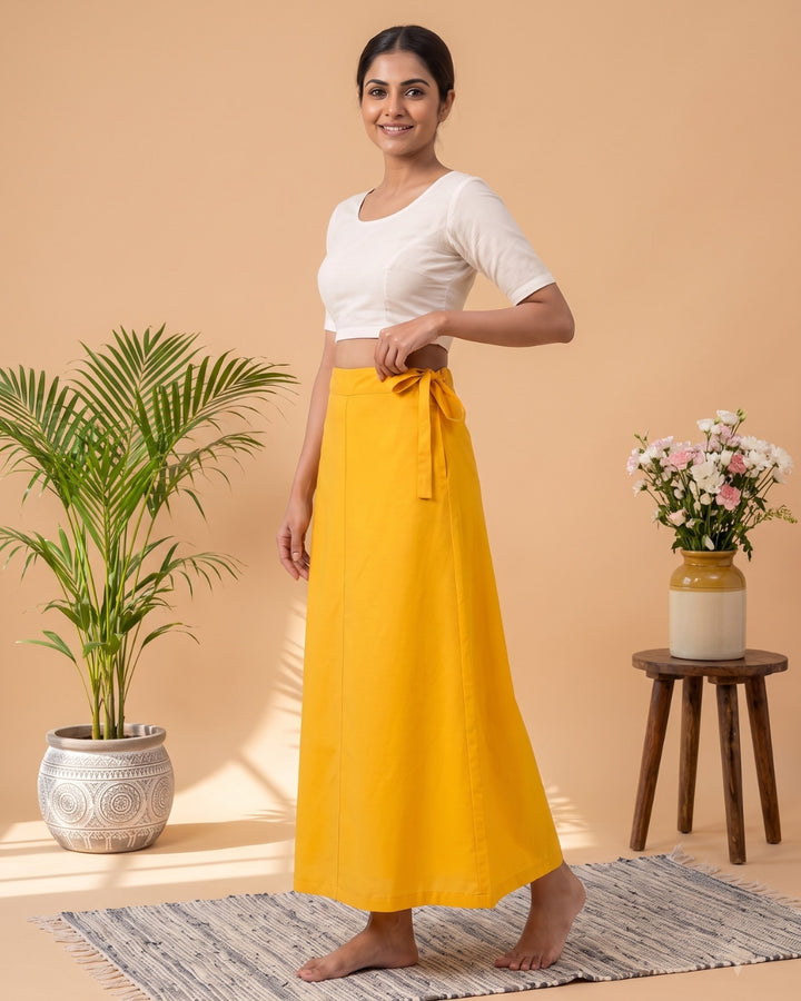 Yellow cotton saree petticoat, model with background #colour_yellow